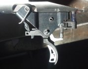 savage trigger w spring on outside.jpg