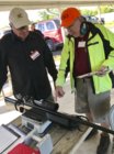 Weighing Roger Johnson rifle.jpg