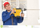 smiling-handyman-big-drill-12503187.jpg