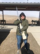 Rhonda with Dads Rifle.jpg