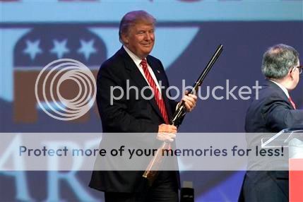 trump-donald-holding-gun1.jpg